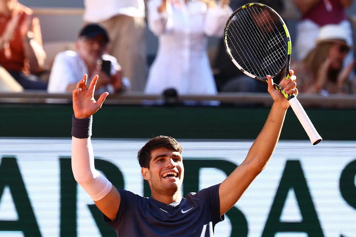 Spain's Carlos Alcaraz celebrates his 2-6 6-3 3-6 6-4 6-3 victory against Italy's Jannik Sinner.