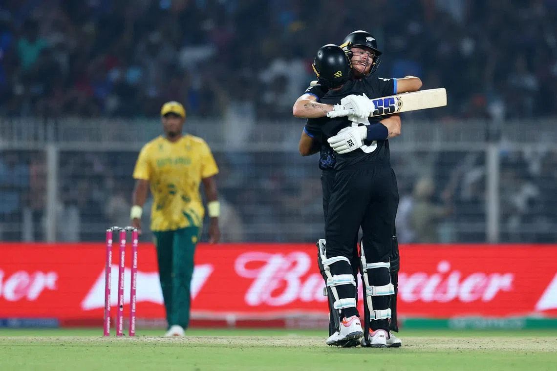 Cricket - ICC Men's T20 World Cup 2026 - Semi Final - South Africa v New Zealand - Eden Gardens, Kolkata, India - March 4, 2026 New Zealand's Finn Allen and Rachin Ravindra celebrate after the match REUTERS/Anushree Fadnavis