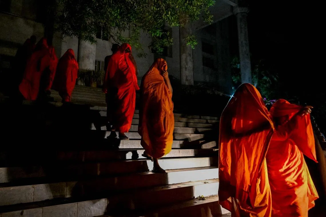 Sri Lankan monks are taken to a detention centre in Colombo after a court hearing in Negombo, Sri Lanka on April 26, 2026. Twenty-two Sri Lankan monks returning from Thailand were arrested on April 26 at the main international airport with 110 kilograms (242 pounds) of powerful cannabis, officials said. 