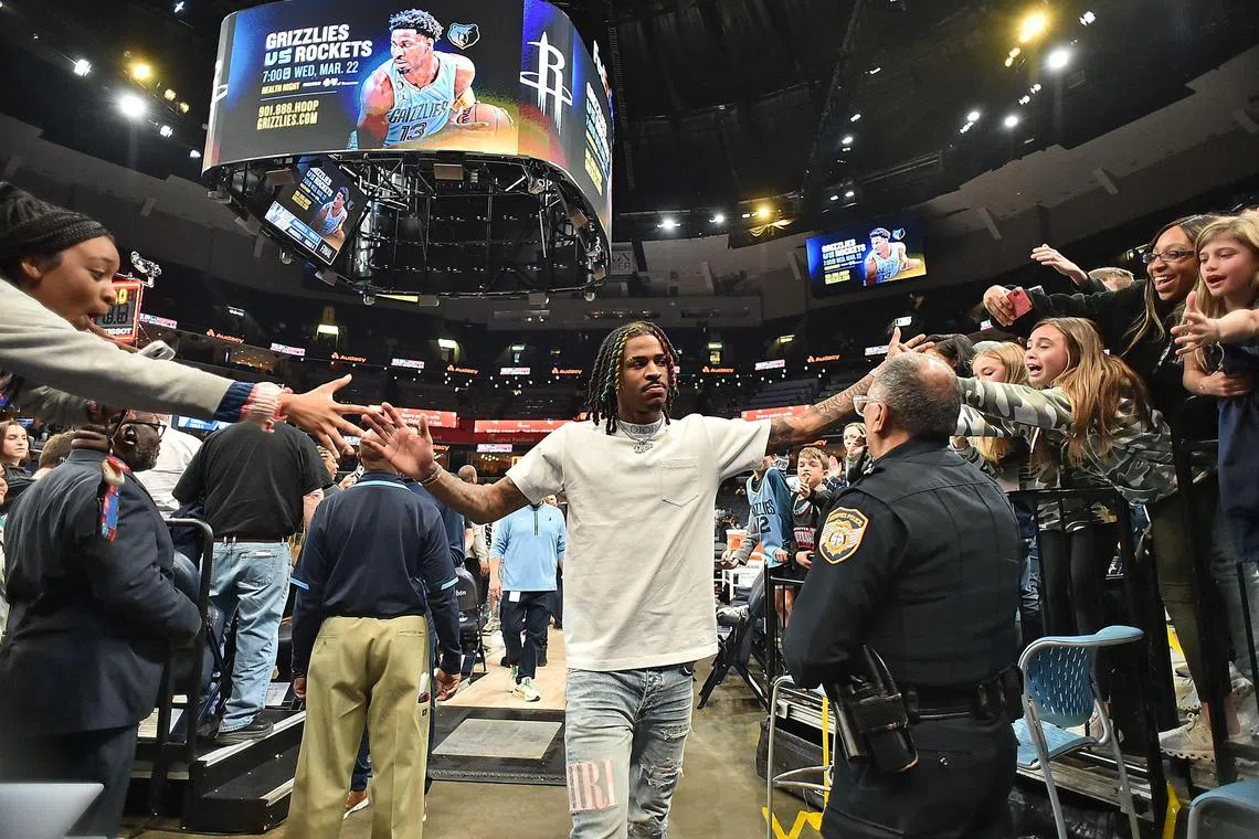 Ja Morant walking off the court as a spectator after the game against the Dallas Mavericks at FedExForum.