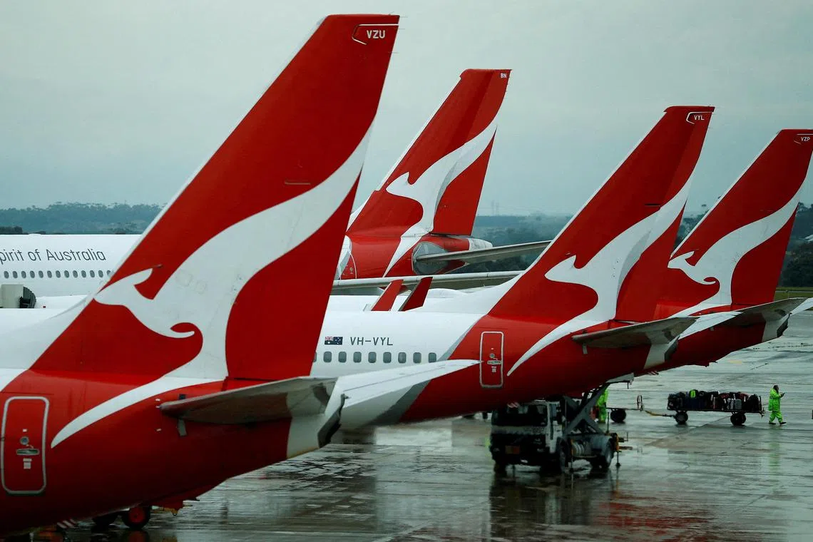 FILE PHOTO: FILE PHOTO: Qantas aircraft are seen on the tarmac at Melbourne International Airport in Melbourne, Australia, November 6, 2018. REUTERS/Phil Noble//File Photo/File Photo