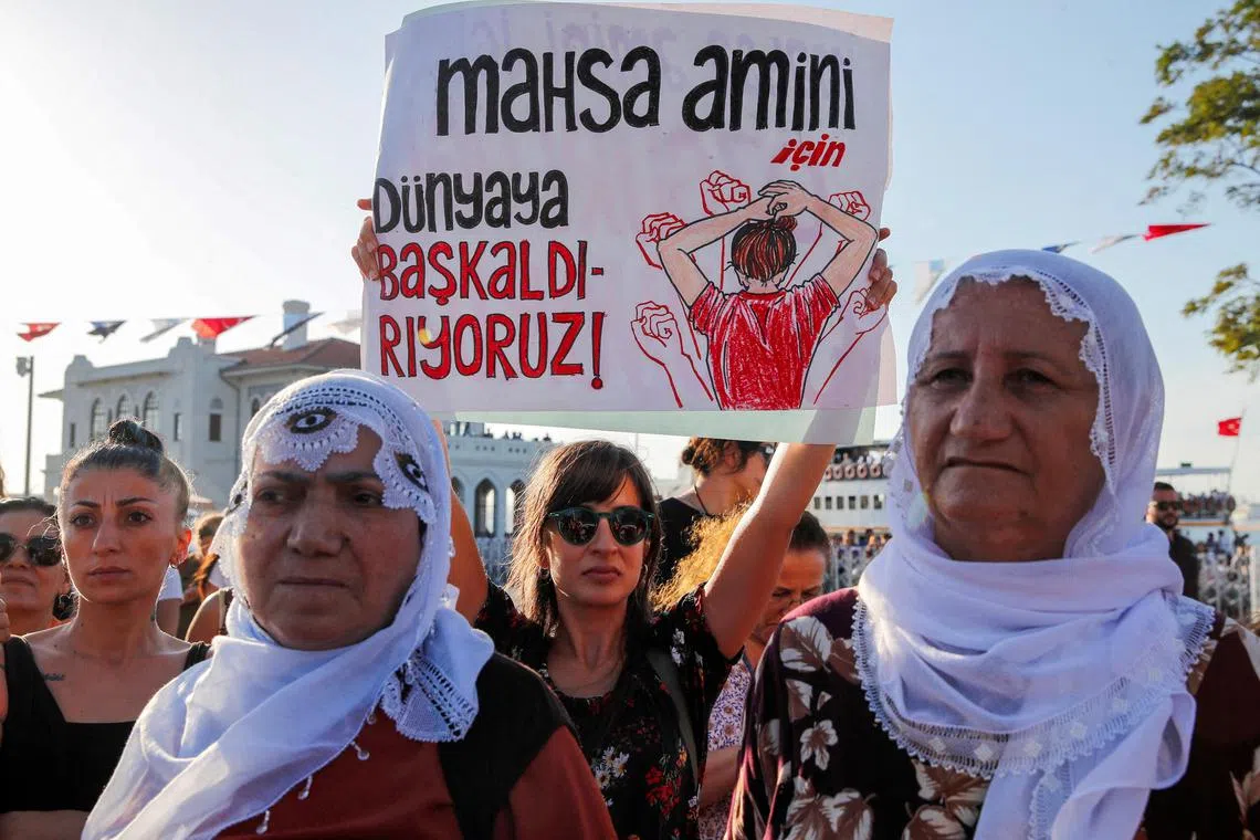 FILE PHOTO: Women take part in a rally on the first anniversary of the death of Mahsa Amini.