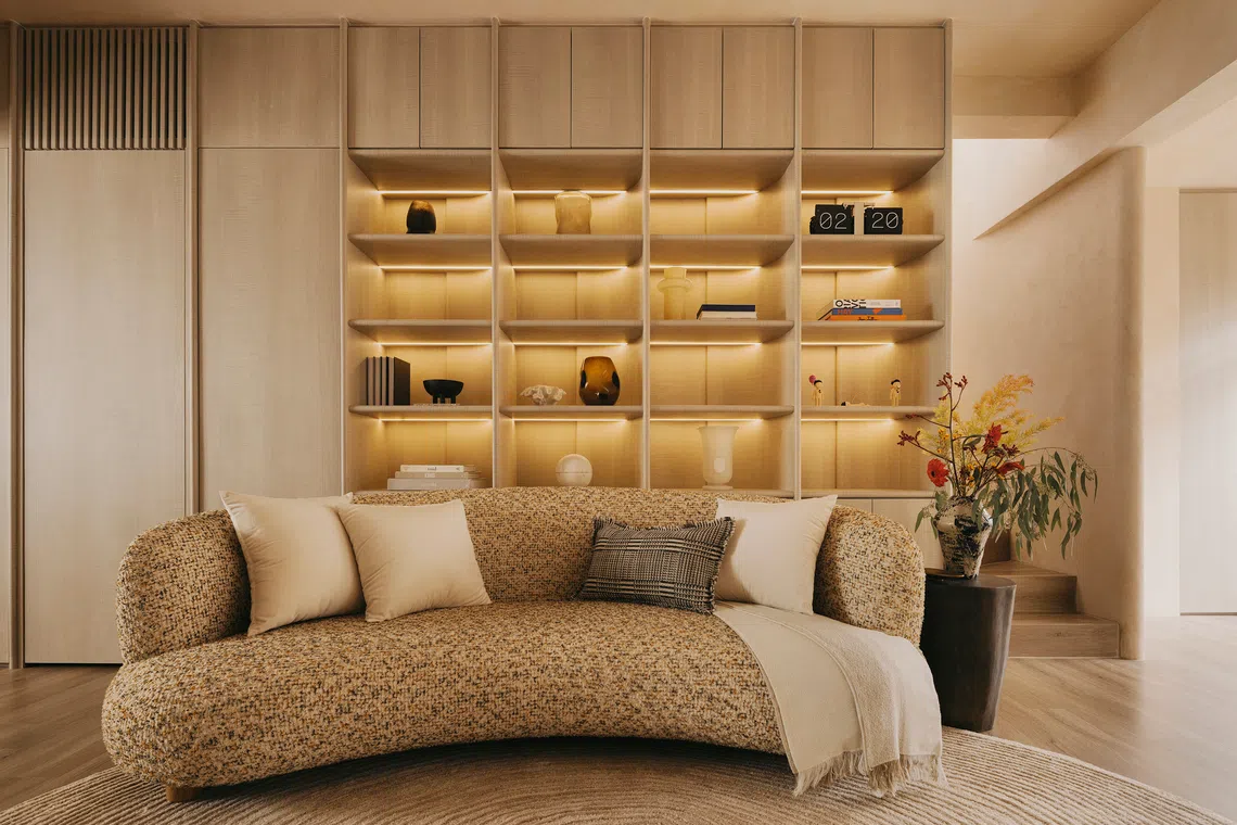 A custom-made shelving unit is the centrepiece of the living room.