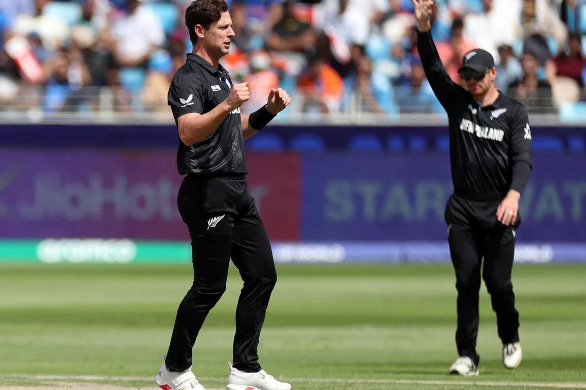 Cricket - ICC Men's Champions Trophy - Group A - India v New Zealand - Dubai International Stadium, Dubai, United Arab Emirates - March 2, 2025 New Zealand's Matt Henry celebrates with teammates after taking the wicket of India's Virat Kohli, caught out by Glenn Phillips REUTERS/Satish Kumar/File Photo