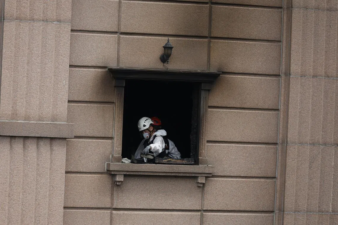 A joint investigation team examines the site of a fire at a hotel in Bucheon on Aug 23, 2024.