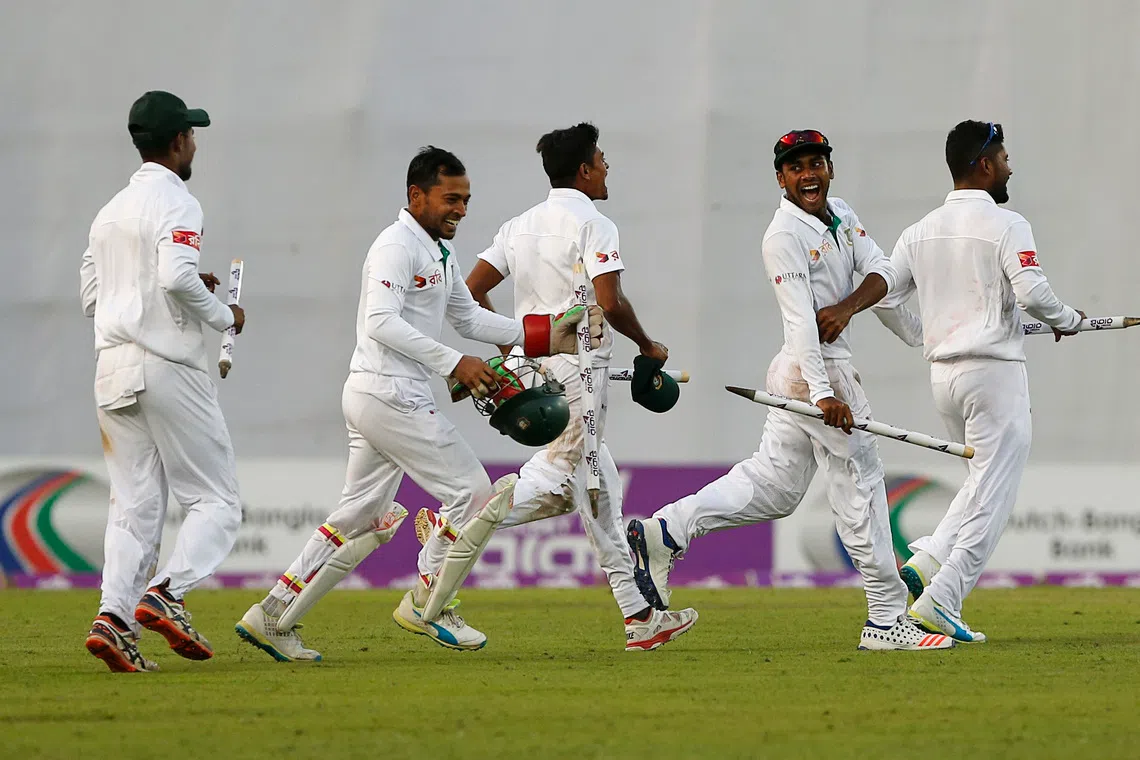 FILE PHOTO: Cricket - Bangladesh v England - Second Test cricket match - Sher-e-Bangla Stadium, Dhaka, Bangladesh - 30/10/16. Bangladesh's players celebrate after winning the match. REUTERS/Mohammad Ponir Hossain/File Photo
