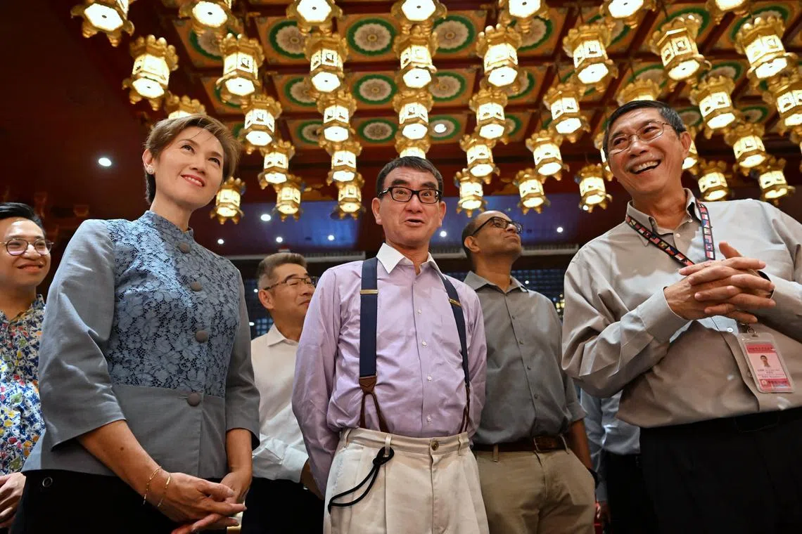 (From left) Minister for Communications and Information Josephine Teo, Japan Minister for Digital Transformation Kono Taro and deputy executive director of Buddha Tooth Relic Temple Ee Tiang Hwee.