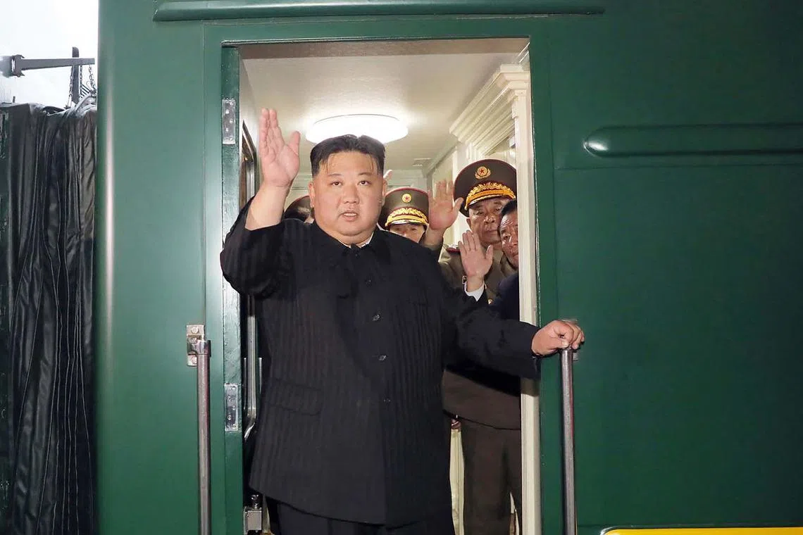 North Korea's leader Kim Jong Un waving as he departs by train from Pyongyang for a visit to Russia on Sept 10.  He was en route to Russia by armoured train to meet President Vladimir Putin, state media reported on Sept 12, with the face-to-face discussions potentially focused on weapon sales. 