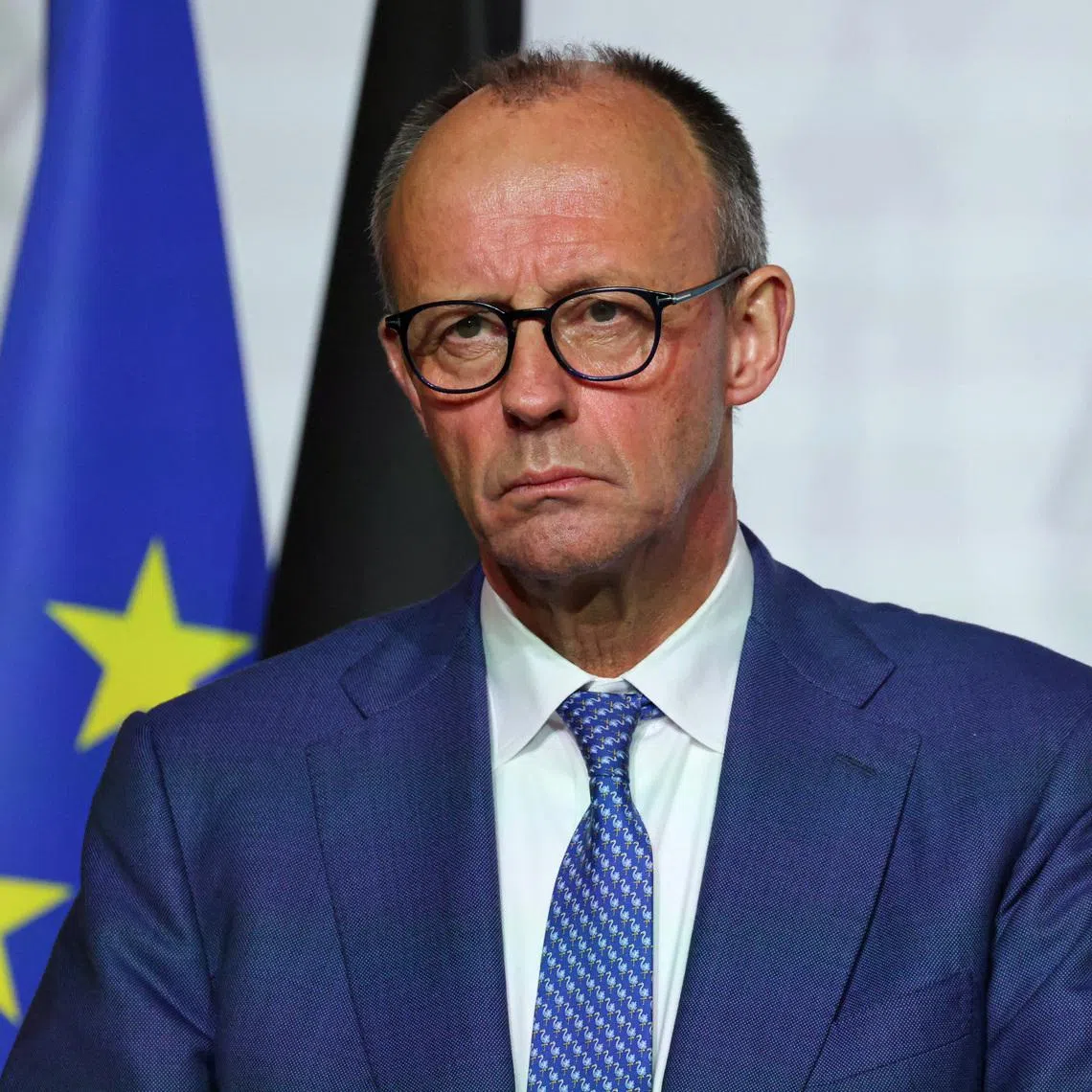 FILE PHOTO: Germany's Chancellor Friedrich Merz looks on as he delivers a press conference upon the signing of the declaration on deploying post-ceasefire force in Ukraine, during the so-called 'Coalition of the Willing' summit, at the Elysee Palace in Paris, France, January 6, 2026. Ludovic Marin/Pool via REUTERS/File Photo