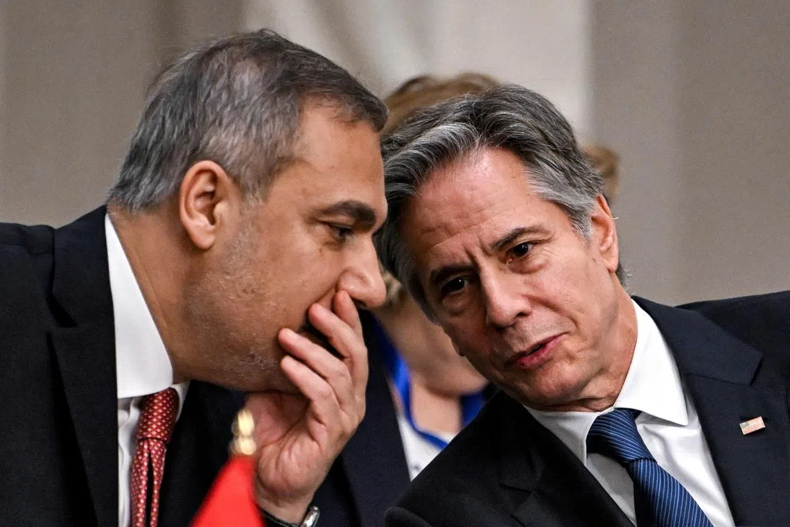 Turkey's Foreign Minister Hakan Fidan speaks with U.S. Secretary of State Antony Blinken during a meeting with the foreign ministers of the Arab Contact Group on Syria in Jordan's southern Red Sea coastal city of Aqaba on December 14, 2024. ANDREW CABALLERO-REYNOLDS/Pool via REUTERS/File Photo