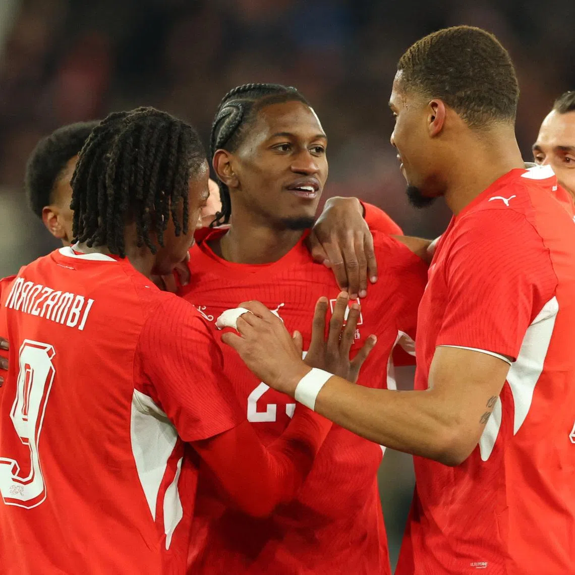 FILE PHOTO: Soccer Football - International Friendly - Switzerland v Germany - St. Jakob-Park, Basel, Switzerland - March 27, 2026 Switzerland's Joel Almada Monteiro celebrates scoring their third goal with teammates REUTERS/Denis Balibouse/File Photo