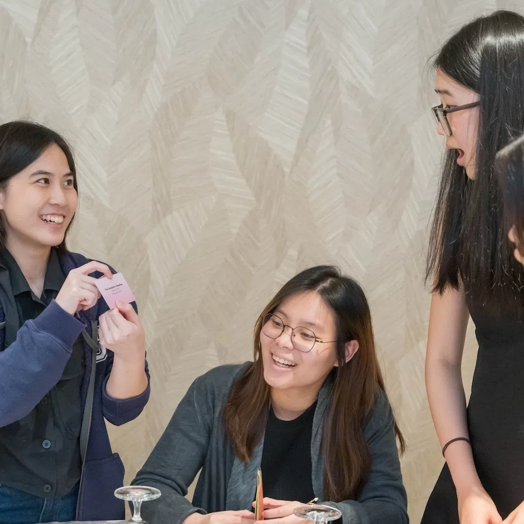 At a workshop organised by UOB in July, Ms Sarah Chee (second from left) learnt financial concepts, such as the importance of insurance and building passive income, through a board game.