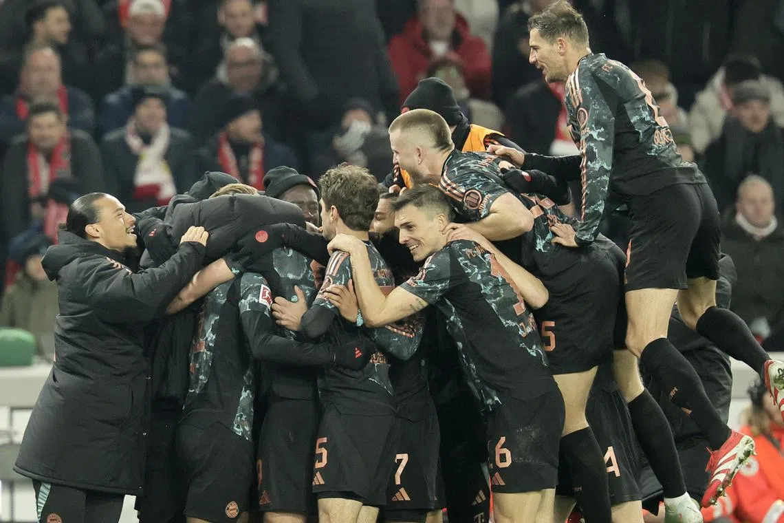 Bayern Munich players celebrate after scoring in the 3-1 Bundesliga win over Stuttgart.