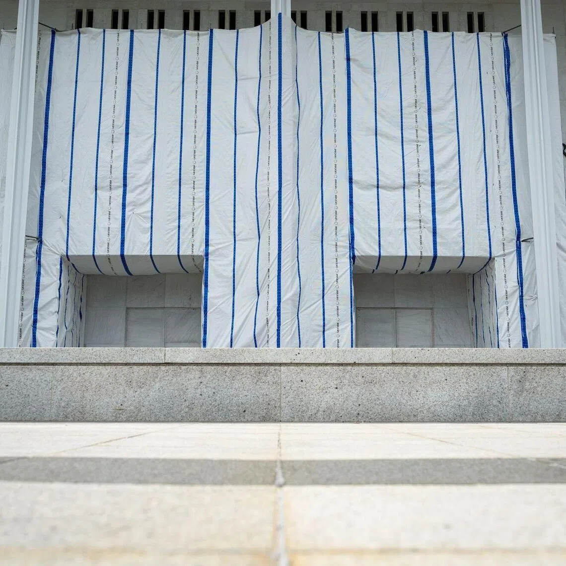 A tarp covers the facade of the Kennedy Center in Washington, DC, on Sept 3.