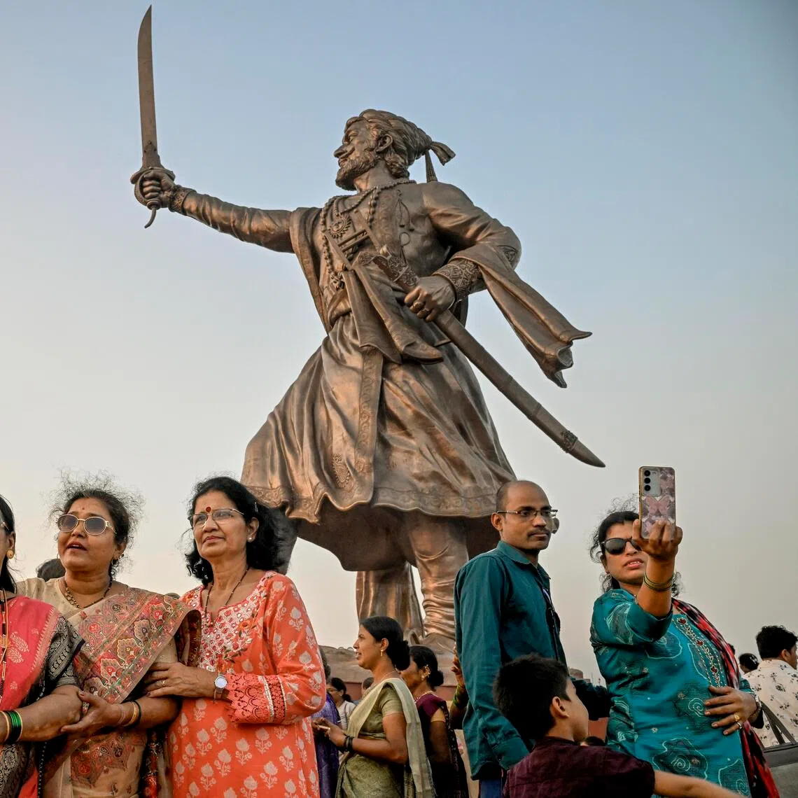 Visitors with the Shivaji statue in Malvan, a small town in Maharashtra, India, in January. There has been a surge of interest in the Hindu warrior in recent years.