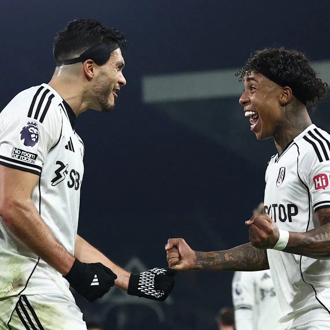 Soccer Football - Premier League - Fulham v Nottingham Forest - Craven Cottage, London, Britain - December 22, 2025 Fulham's Raul Jimenez celebrates scoring their first goal with Kevin REUTERS/David Klein