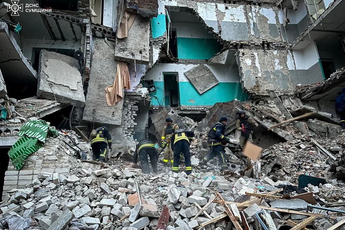 Rescuers work at a residential building hit by a Russian drone strike, amid Russia's attack on Ukraine, in the town of Hlukhiv, Sumy region, Ukraine, in this handout picture released November 19, 2024. Press service of the State Emergency Service of Ukraine in Sumy region/Handout via REUTERS/File Photo