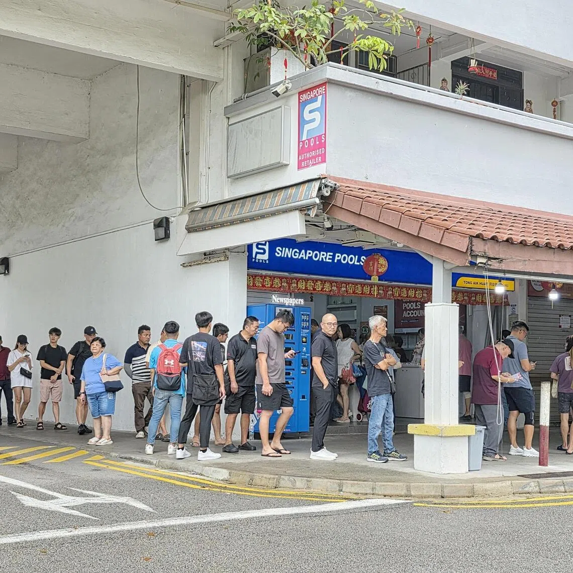 Queues had formed at Singapore Pools outlets islandwide ahead of the draw at 9.30pm on Feb 27.