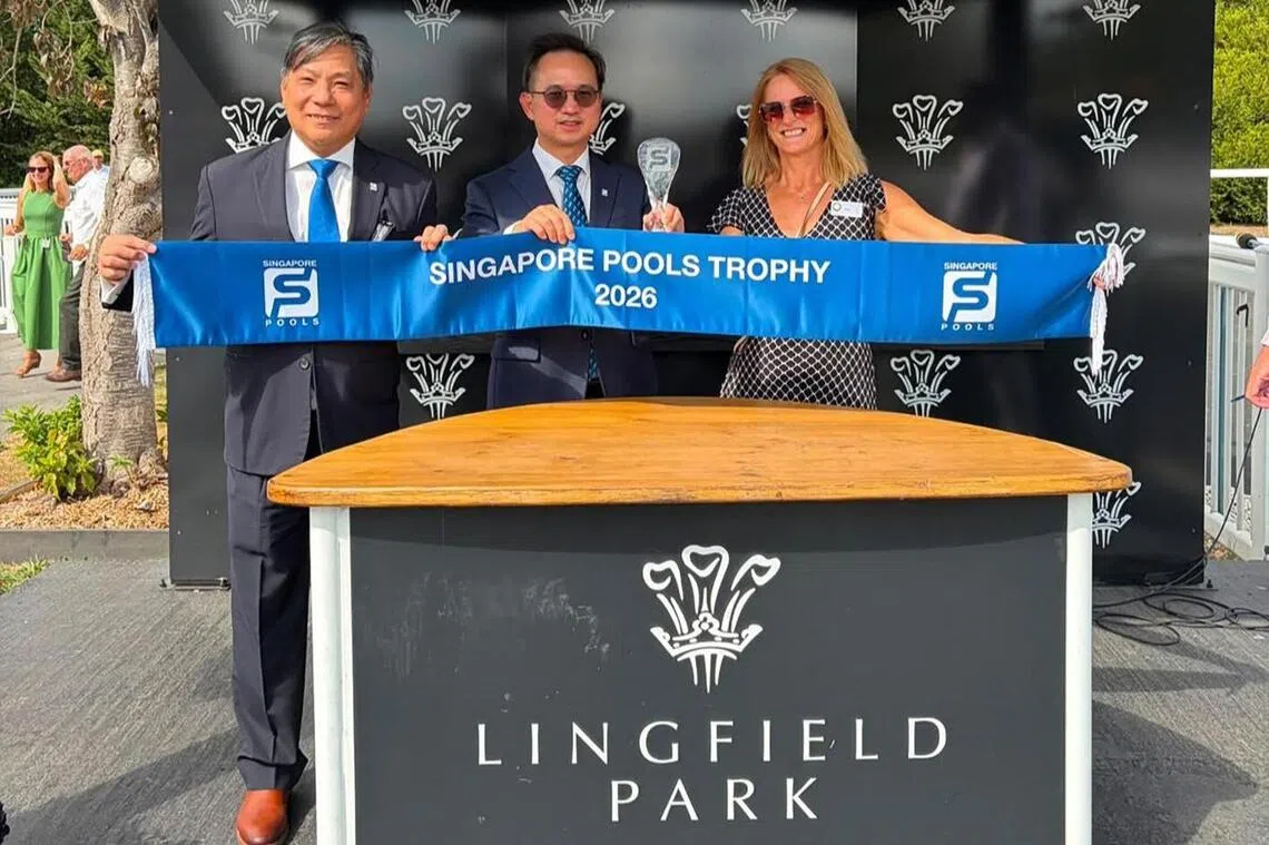 pools19 - Singapore Pools’ chief product officer Simon Leong (near right), chief executive officer Lam Chee Weng (centre) and owner representative Jayne Howick are all smiles after Rapide Vega won the inaugural Singapore Pools Trophy (1,600m) at Lingfield on Aug 17. 
PHOTO COURTESY OF SINGAPORE POOLS