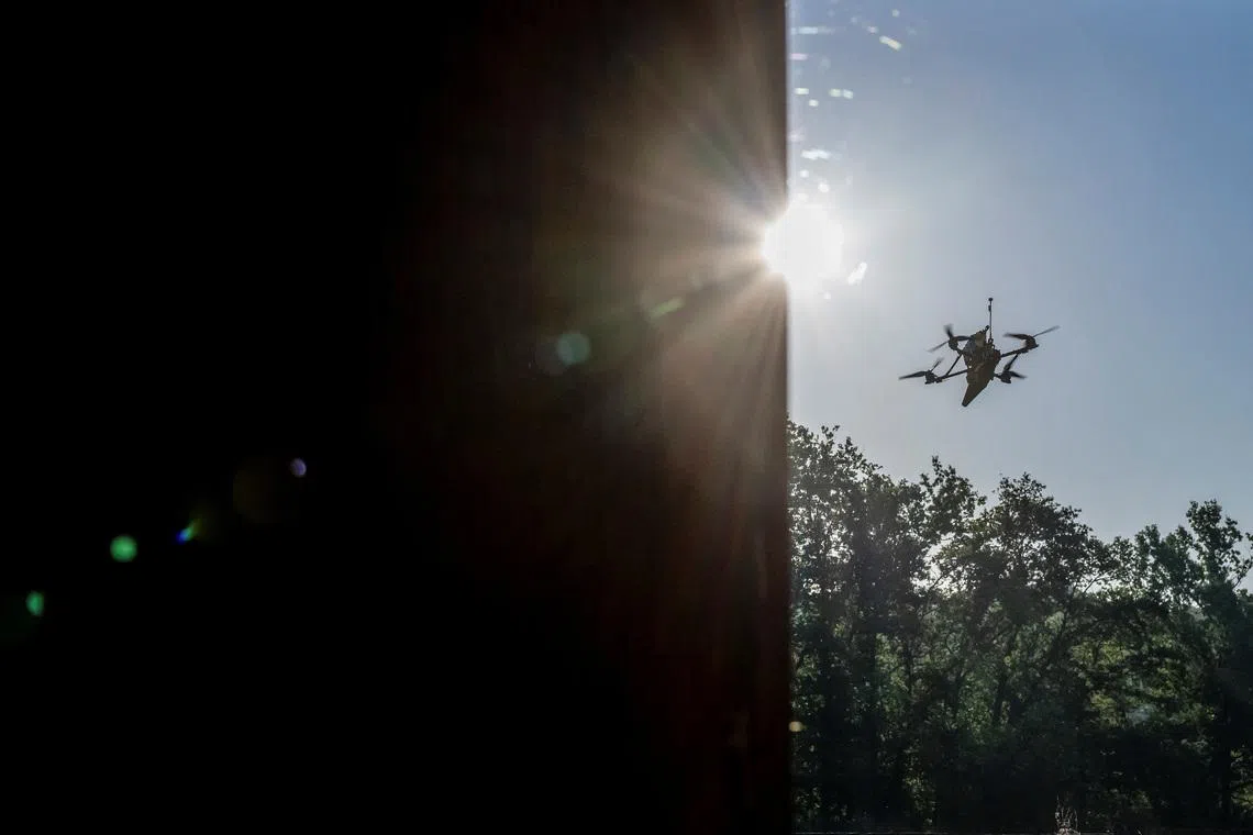 A Ukrainian first-person view (FPV) drone flies near a Russian border in a Kharkiv region, Ukraine June 14, 2024. REUTERS/Viacheslav Ratynskyi