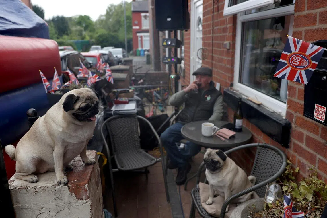 A resident taking part in a street party during celebrations commemorating the 80th anniversary of Victory in Europe Day, in Manchester, Britain, on May 5, 2025. 
