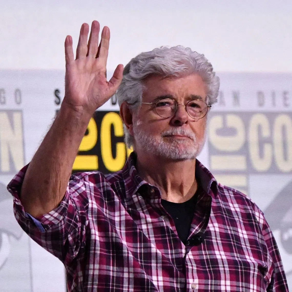 US filmmaker George Lucas arrives for the Sneak Peek of the Lucas Museum of Narrative Art panel in Hall H of the convention center during Comic Con International in San Diego, California on July 27, 2025. (Photo by Chris DELMAS / AFP)