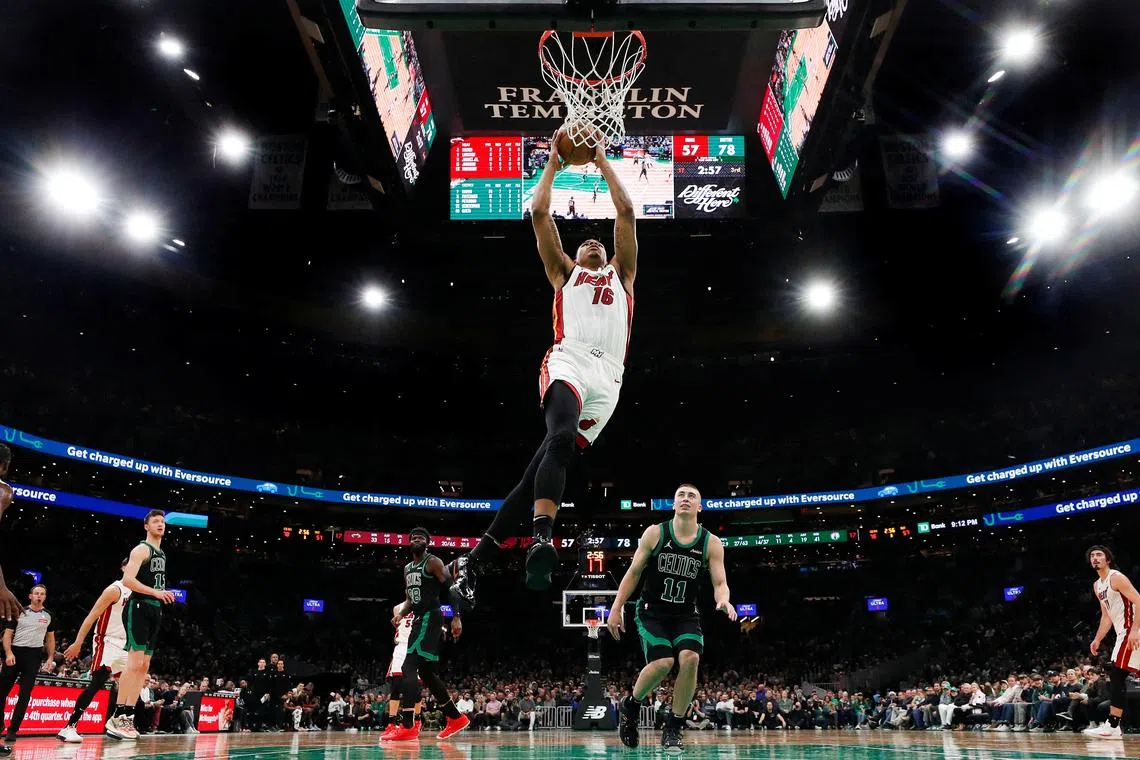 FILE PHOTO: Dec 2, 2024; Boston, Massachusetts, USA; Miami Heat forward Keshad Johnson (16) goes in for a dunk against the Boston Celtics during the second half at TD Garden. Winslow Townson-Imagn Images/File Photo