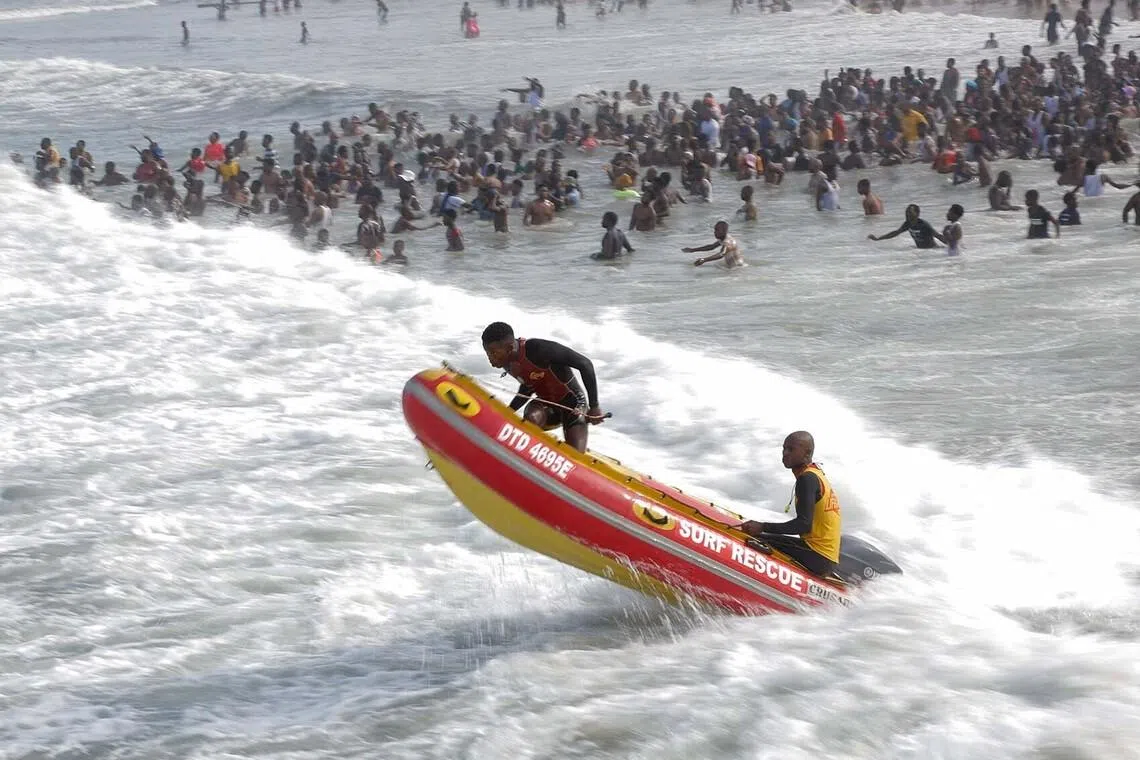 Lifesavers keeping an eye on New Year's day revellers at Durban North beach in Durban, South Africa, Jan 1, 2026. 