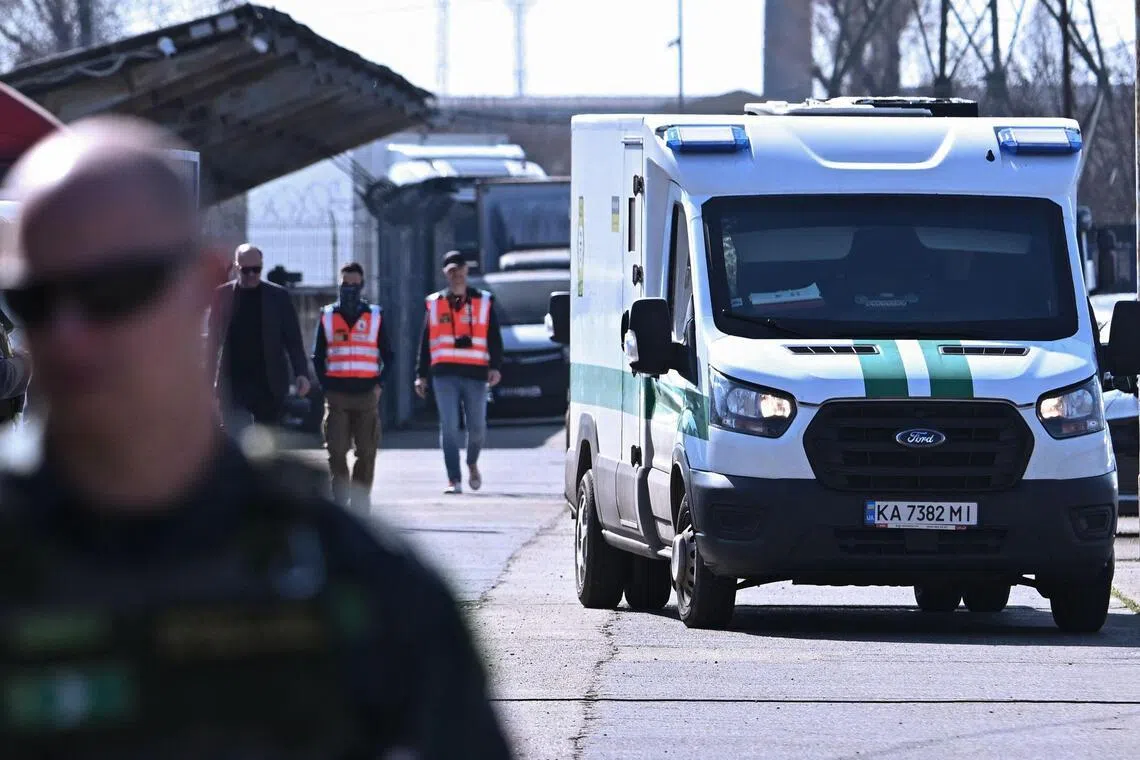 Officials from Hungary's National Tax and Customs Administration returning one of two Ukrainian armoured cash transport vehicles to the State Savings Bank of Ukraine, in Budapest, on March 12.