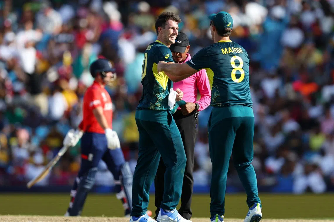 FILE PHOTO: Cricket - ICC T20 World Cup 2024 - Group B - Australia v England - Kensington Oval, Bridgetown, Barbados - June 8, 2024 Australia's Pat Cummins celebrates with Mitchell Marsh after taking the wicket of England's Liam Livingstone REUTERS/Ash Allen/File photo