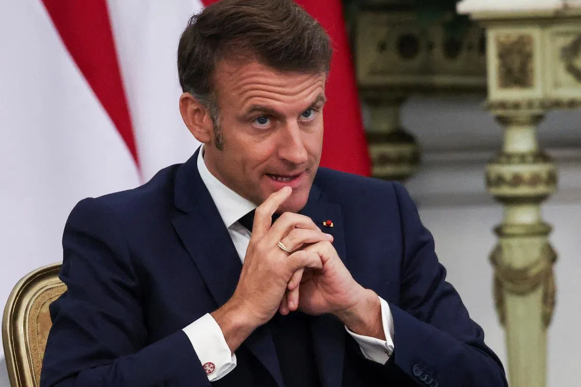 French President Emmanuel Macron gestures during an agreement signing at the Merdeka Palace in Jakarta, Indonesia, May 28, 2025. REUTERS/Ajeng Dinar Ulfiana