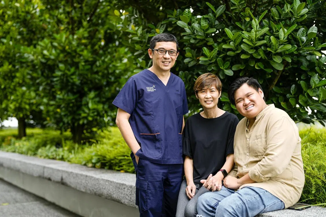 arstem10 - (L-R) Associate Professor Koh Liang Piu, Madam Cynthia Tan and her son Mr Keith Chan. Madam Tan, now 59, decided to go for a haploidentical stem cell transplant in March 2020, with her then 25-year-old son, Mr Keith Chan, as the half-matched donor for the transplant.

Source:  National University Cancer Institute, Singapore (NCIS)