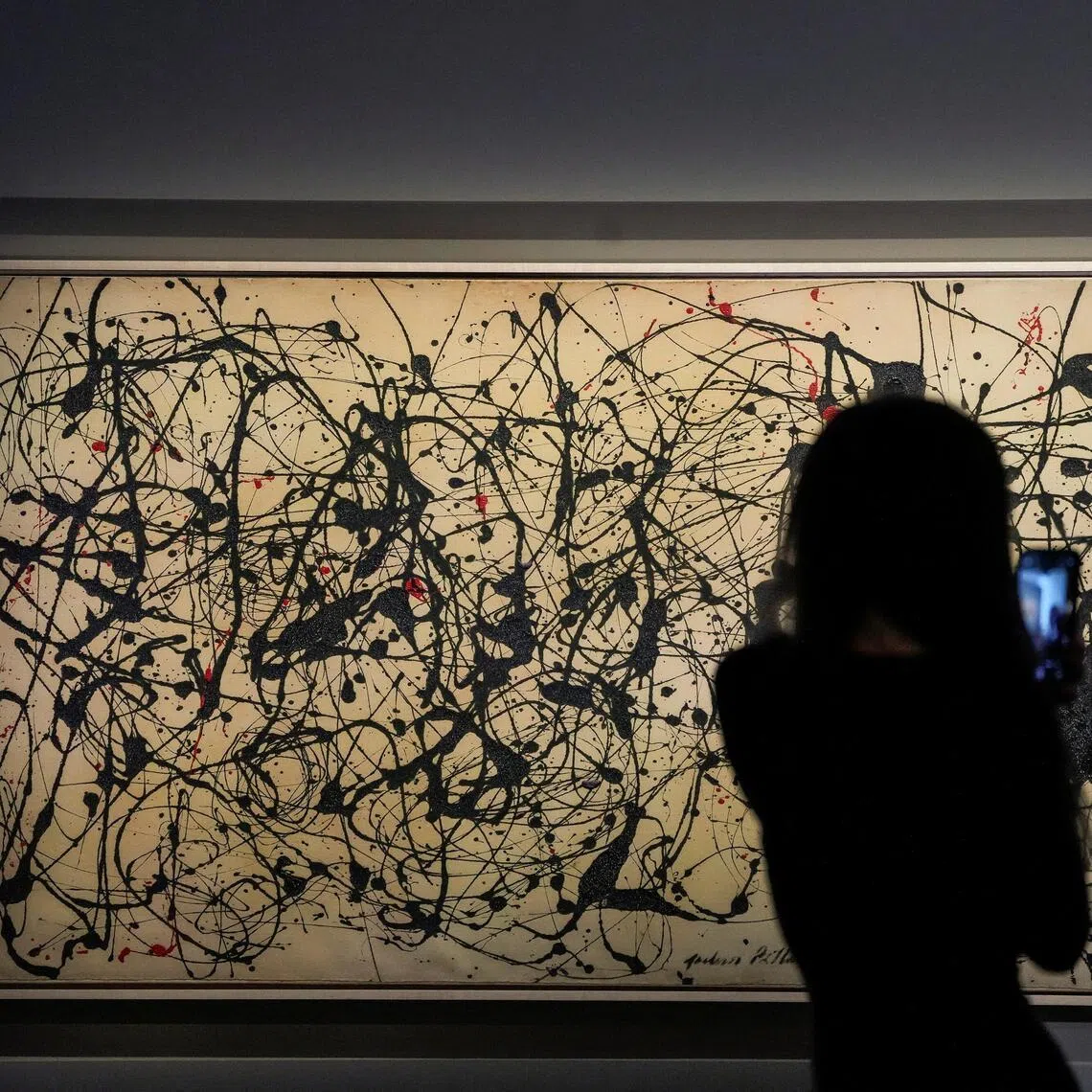 With its black drips of paint accented by touches of red on a huge canvas spanning over 3m, Pollock’s “Number 7A, 1948“ sold for US$181.2 million, including fees.