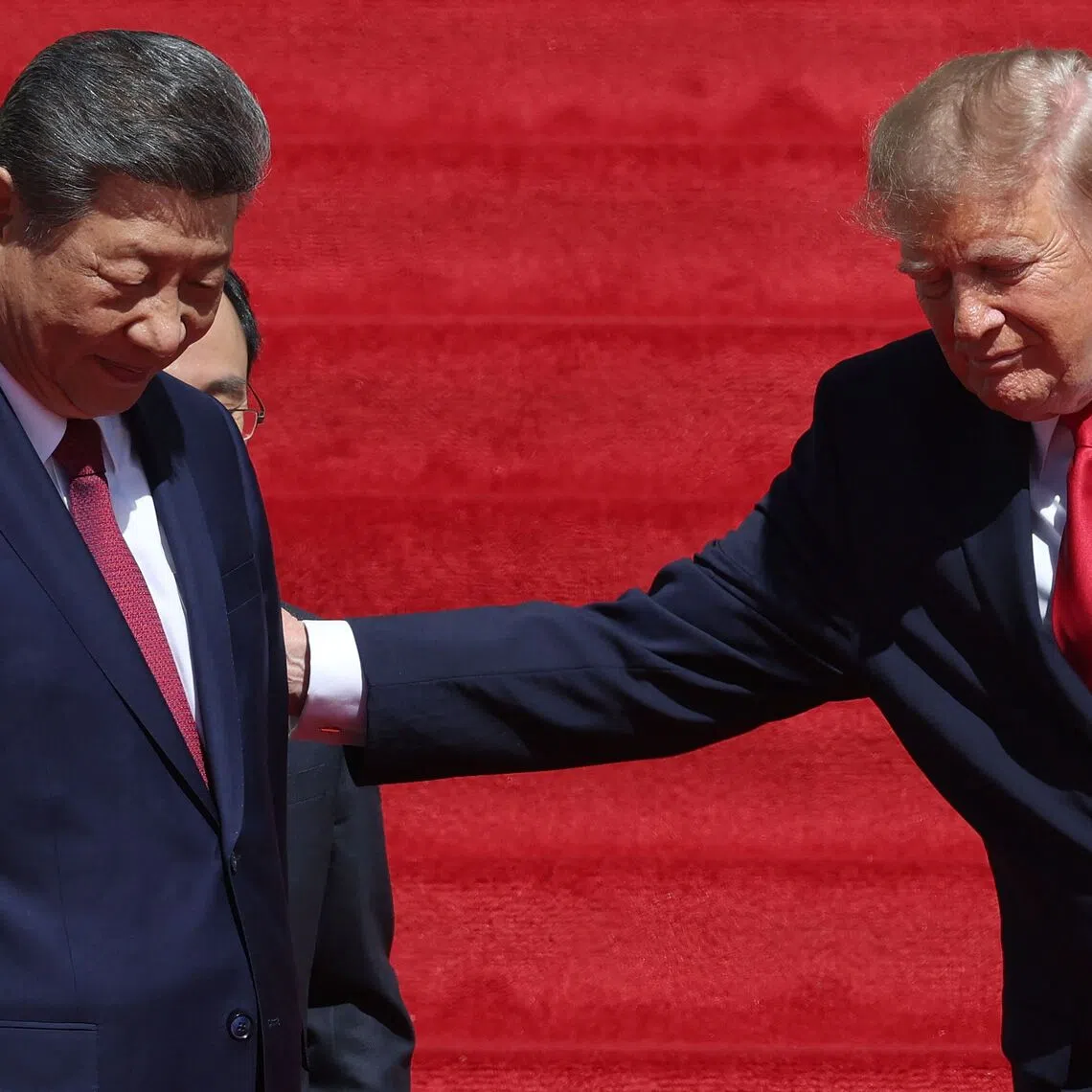 US President Donald Trump and Chinese President Xi Jinping leaving after a tour of the National Archives Museum on Sept 25 in Washington.