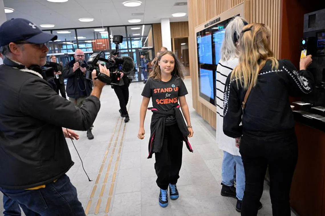 Swedish climate activist Greta Thunberg walks in Malmo district court, in Sweden October 11, 2023.  TT News Agency/Johan Nilsson via REUTERS