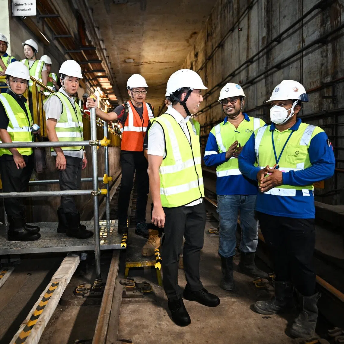 Acting Transport Minister Jeffrey Siow (third from right) inside the tunnel at Dakota MRT station during an update on progress of Circle Line tunnel strengthening works on March 26.