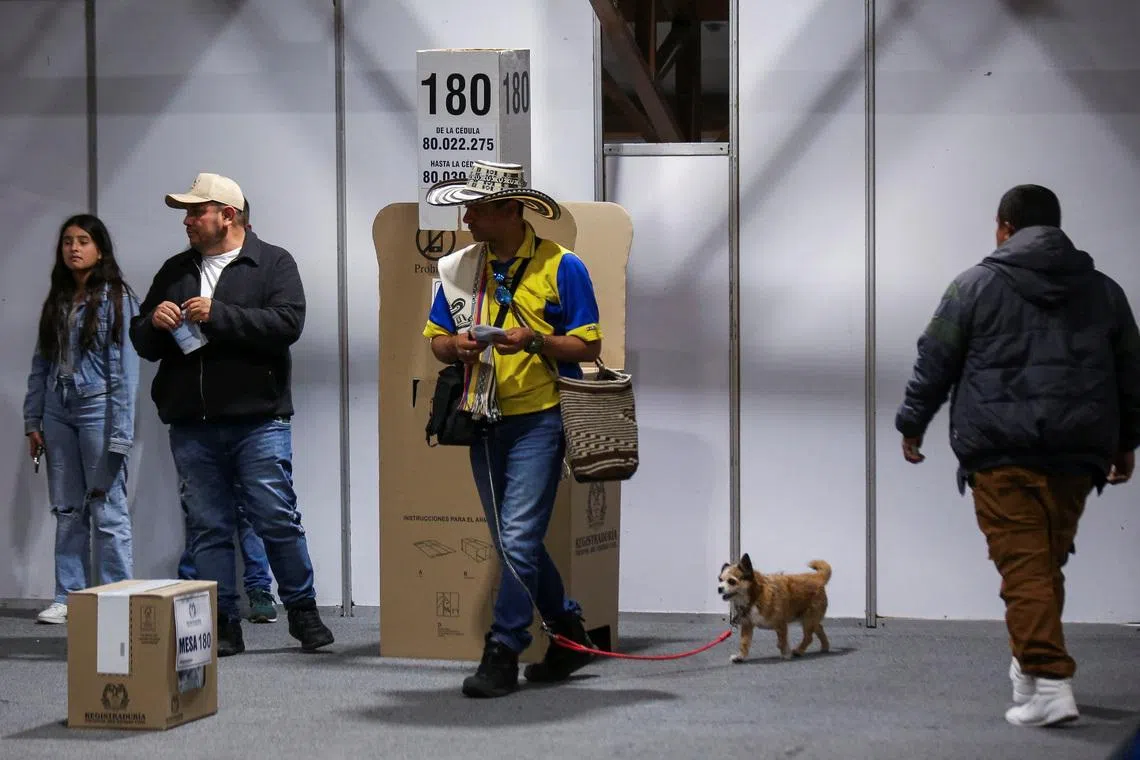 People vote at Colombia's largest polling station during a runoff between right-wing presidential candidate Abelardo De La Espriella and leftist candidate Ivan Cepeda, in Bogota, Colombia, on June 21.