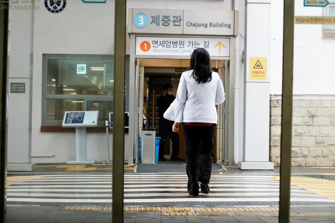 FILE PHOTO: A medical worker walks at Severance Hospital in Seoul, South Korea, February 21, 2024. REUTERS/Kim Soo-Hyeon/File Photo
