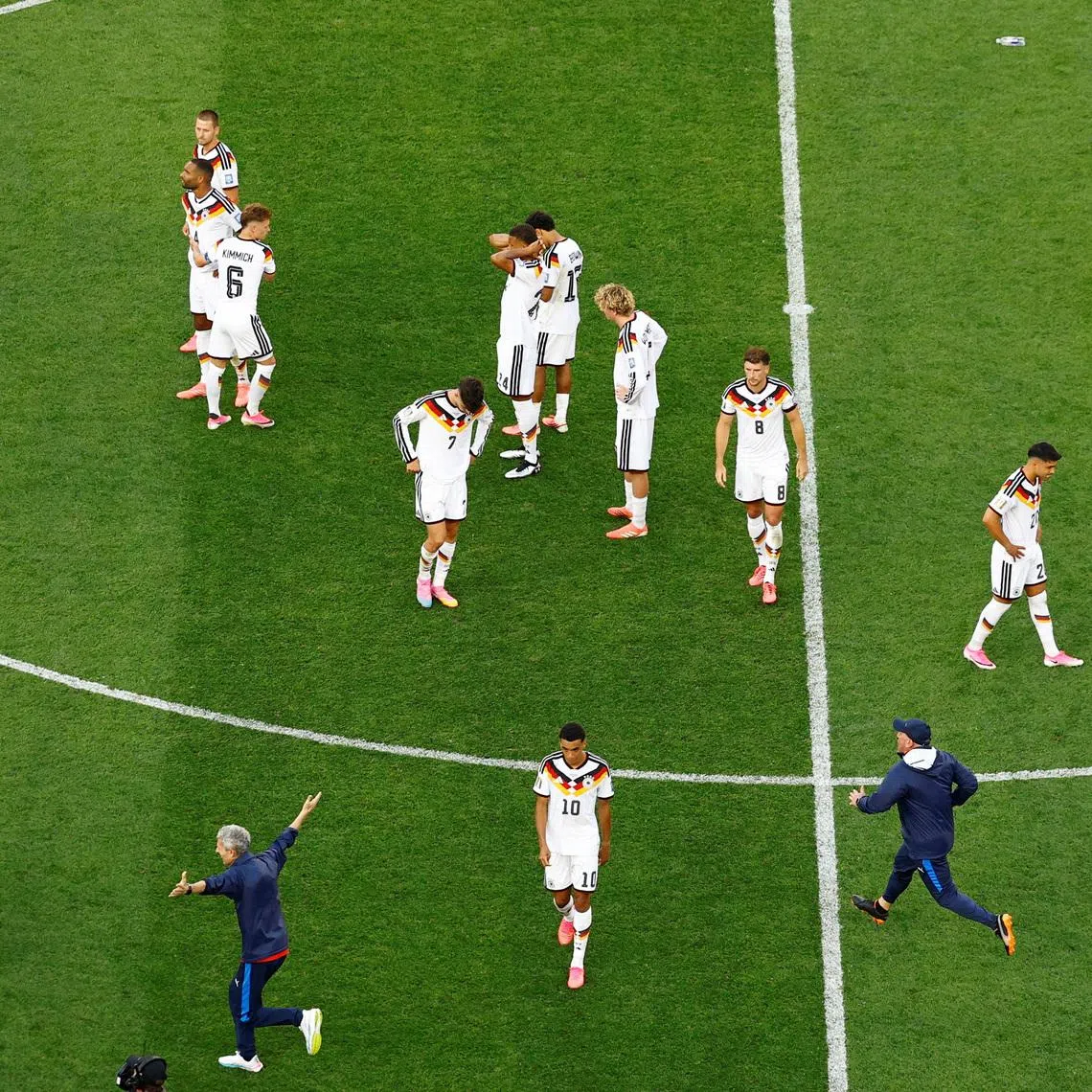 Soccer Football - FIFA World Cup 2026 - Round of 32 - Germany v Paraguay - Boston Stadium, Foxborough, Massachusetts, U.S. - June 29, 2026 Germany's Jamal Musiala with teammates look dejected after the match as Germany are eliminated from the World Cup REUTERS/Pilar Olivares