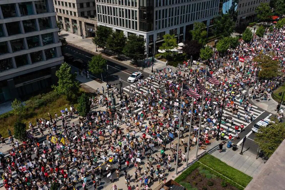 ‘Get off our streets’: Thousands march against Trump’s troop deployment in ...