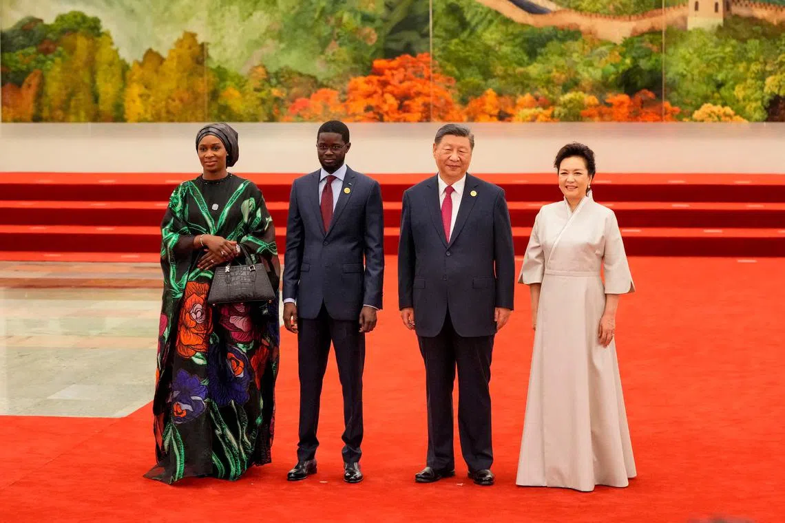 Chinese President Xi Jinping and his wife with Senegal President Bassirou Diomaye Faye (second from left) at the Great Hall of the People in Beijing, on Sept 4.