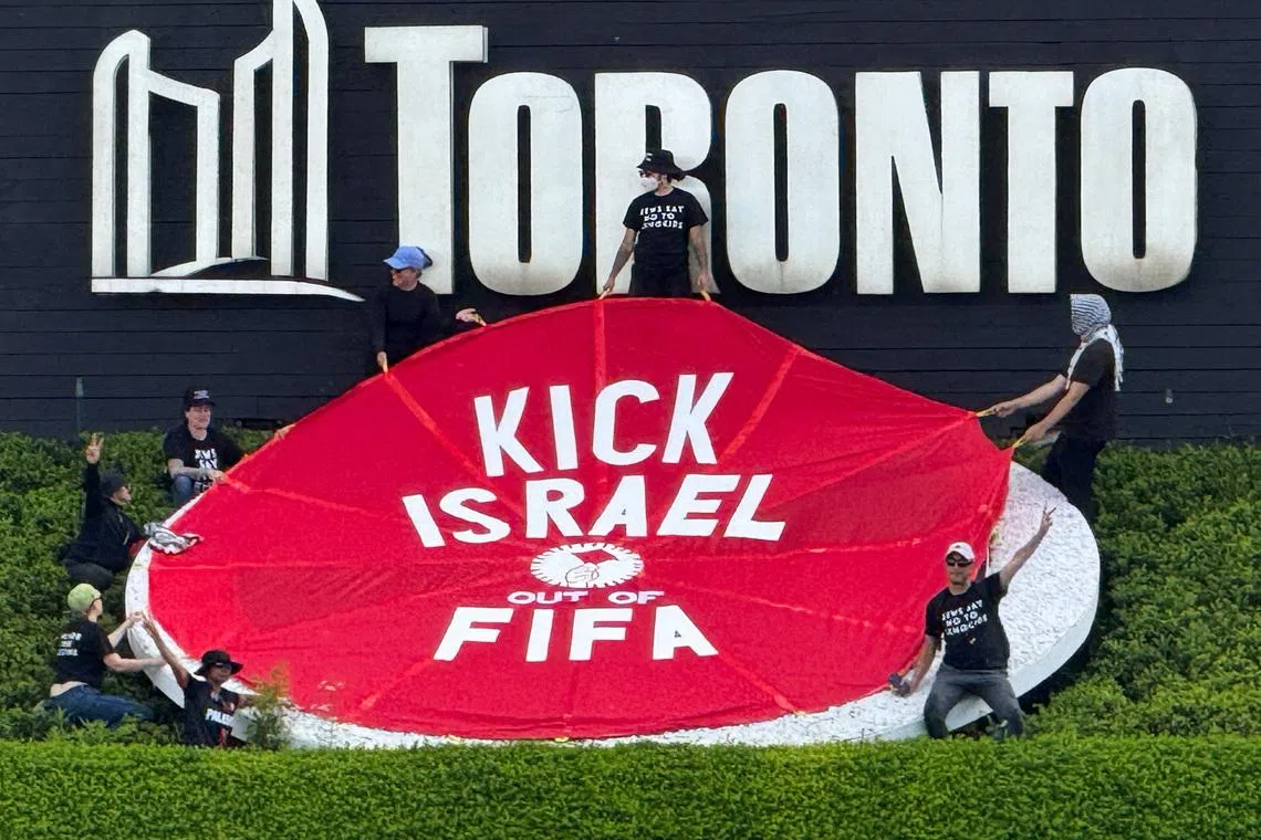 Protesters hold a banner reading \"Kick Israel Out of FIFA\", ahead of Canada's World Cup match against Bosnia and Herzegovina in Toronto, Ontario, Canada, June 12, 2026. REUTERS/Kyaw Soe Oo