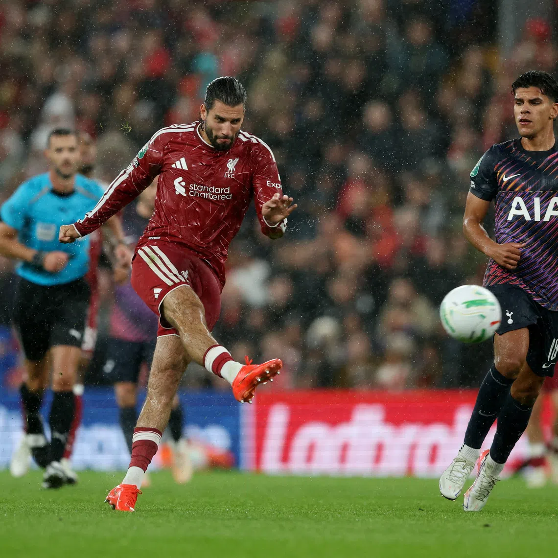 Liverpool’s Dominik Szoboszlai scores their third goal to give his side a 3-1 lead against Tottenham Hotspur in stoppage time.