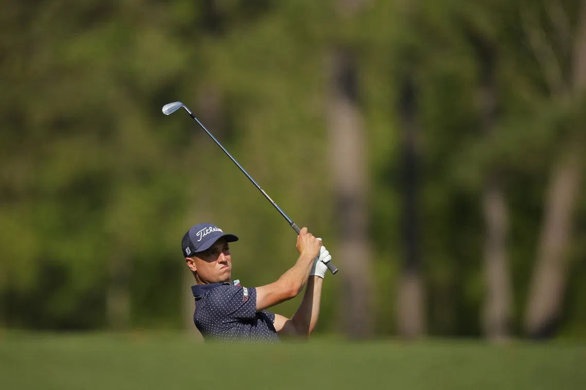 FILE PHOTO: Golf - The Masters - Augusta National Golf Club, Augusta, Georgia, U.S. - April 11, 2025 Justin Thomas of the U.S. hits his tee shot on the 12th hole during the second round REUTERS/Mike Blake/File Photo