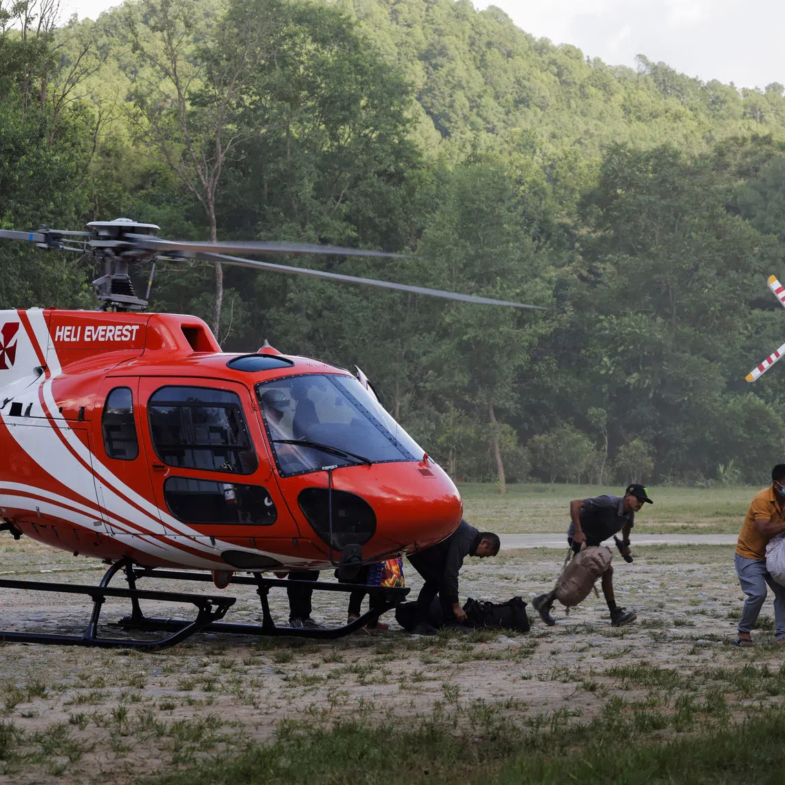 People rescued and airlifted from flood-affected areas arrive at Maithali Barrack, an army training centre, which serves as a primary base to airlift survivors following flash floods and mudslide at Trishuli in Nuwakot district, Nepal, August 27, 2026. REUTERS/Navesh Chitrakar