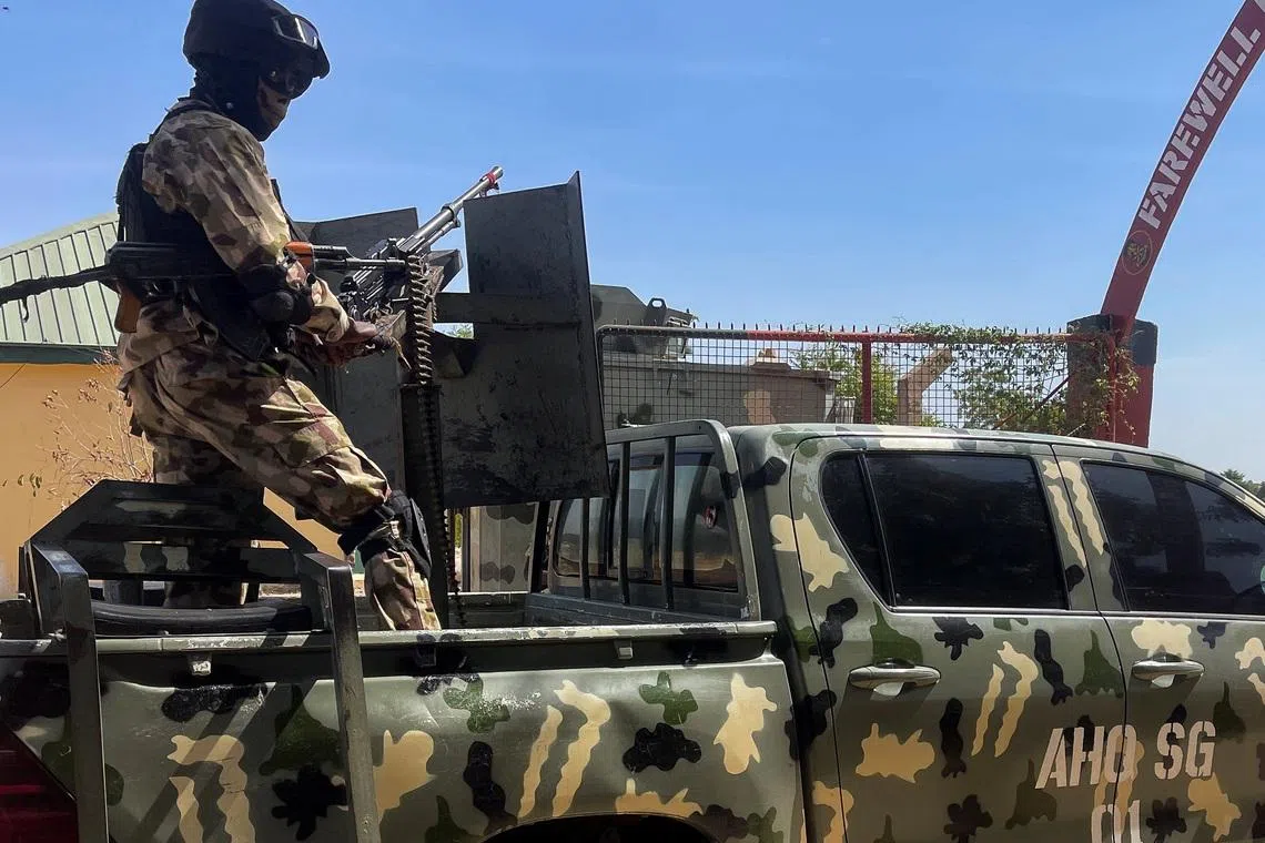 A Nigerian soldier stands on a military truck, during the tour of the Theatre Command Operation Lafiya Dole by Nigeria's Chief of Army Staff, at the Maimalari Cantonment in Maiduguri, Borno, Nigeria, November 7, 2025. REUTERS/Ahmed Kingimi