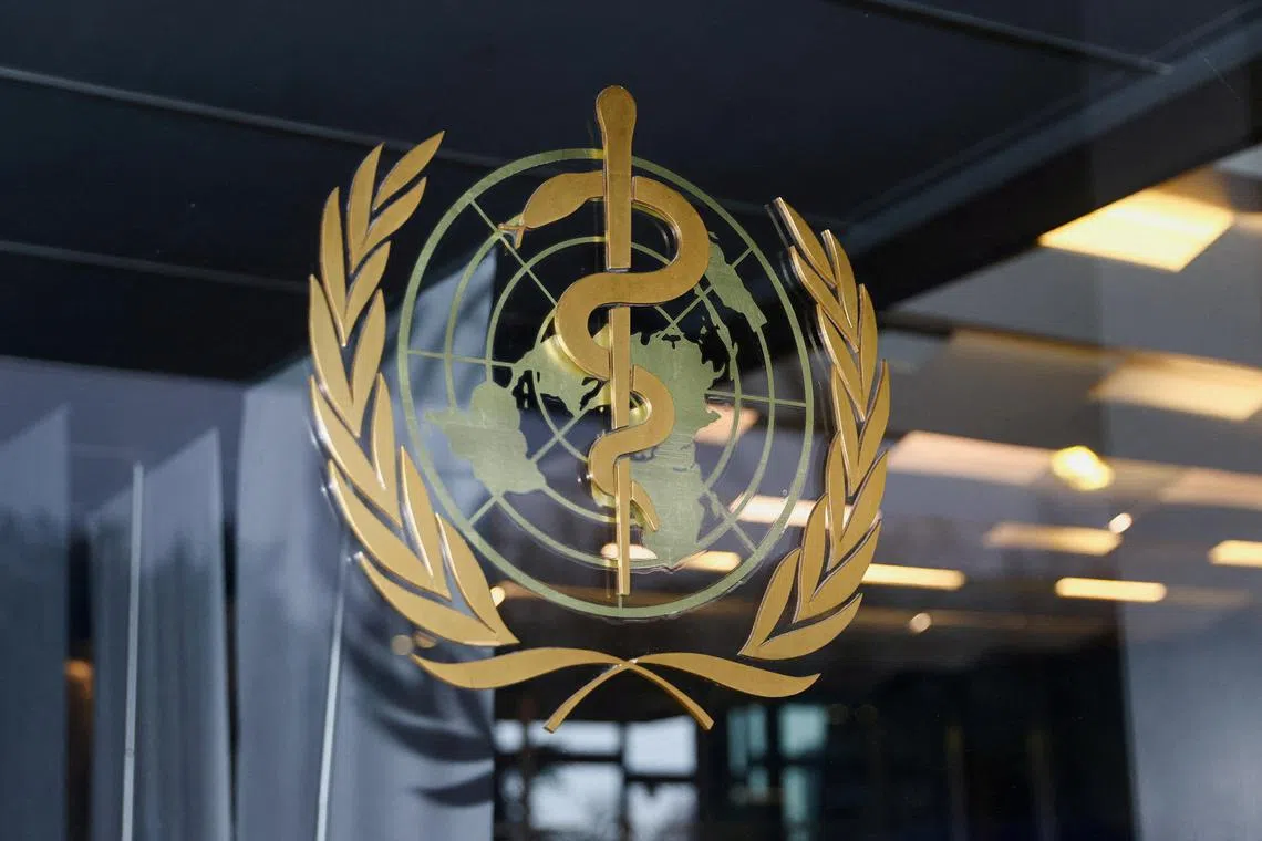FILE PHOTO: The World Health Organization logo is pictured at the entrance of the WHO building, in Geneva, Switzerland, December 20, 2021. REUTERS/Denis Balibouse/File Photo