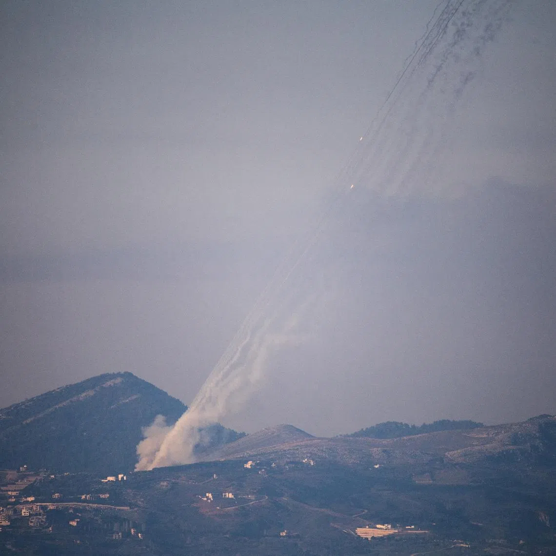 FILE PHOTO: Rockets being launched from Lebanon towards Israel as seen from the Israeli side of the border with Lebanon, following an escalation between Hezbollah and Israel amid the U.S.-Israeli conflict with Iran,  March 3, 2026. REUTERS/Gil Eliyahu/File Photo