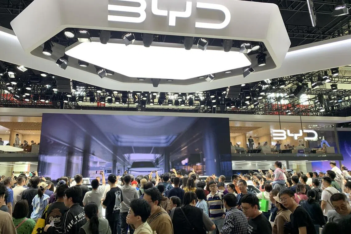 Crowds thronging the booth of China’s largest NEV maker BYD at the Beijing International Automotive Exhibition on May 2, 2024.