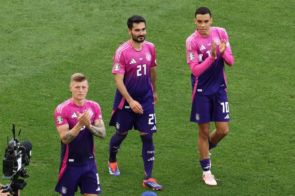 From left: Toni Kroos, Ilkay Gundogan and Jamal Musiala thanking Germany supporters after they beat Hungary 2-0 in their Euro 2024 Group A match in Stuttgart on June 19,  2024.